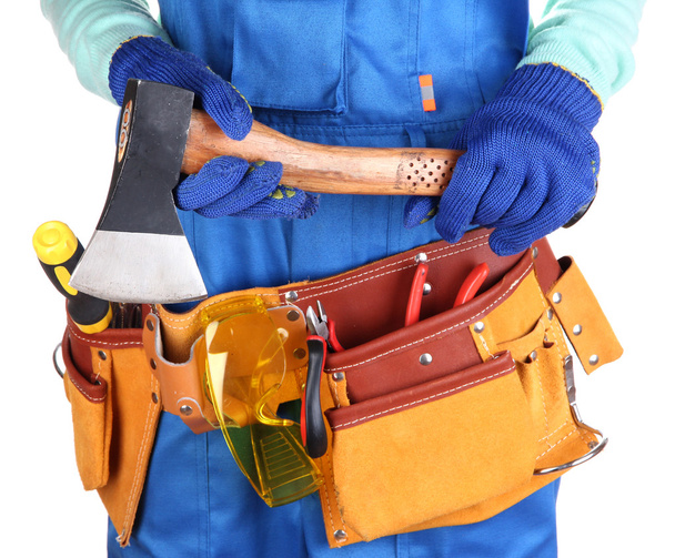 Male builder in blue overalls with hatchet isolated on white - Valokuva, kuva