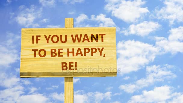 If you want to be happy, be! Words on a wooden sign against time lapse clouds in the blue sky. - Footage, Video