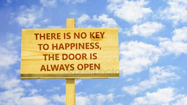 There is no key to happiness the door is always open. Words on a wooden sign against time lapse clouds in the blue sky. - Footage, Video