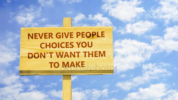 Never give people choices you don't want them to make. Words on a wooden sign against time lapse clouds in the blue sky. - Footage, Video