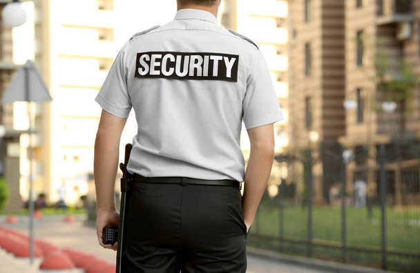 Male security guard standing outdoors - Zdjęcie, obraz