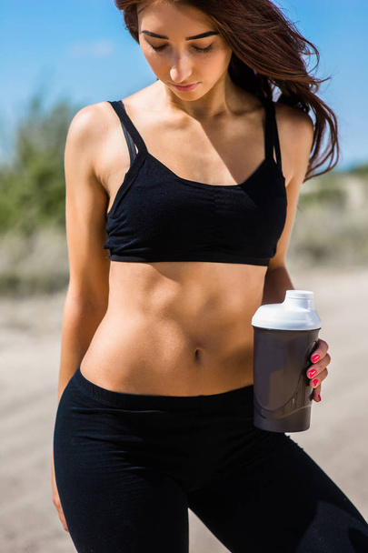 Fitness girl with a shaker - Photo, image