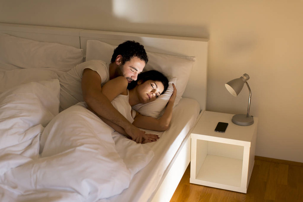 Loving couple on bed - Foto, imagen