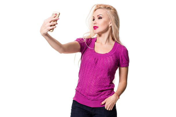 blonde doing selfie on isolated white background - Фото, изображение
