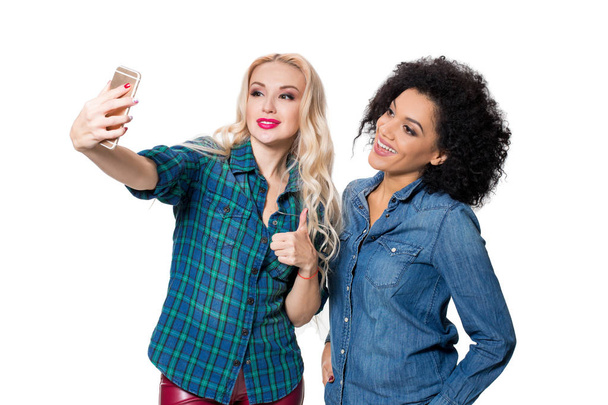 Two beautiful girls making selfie - Photo, Image