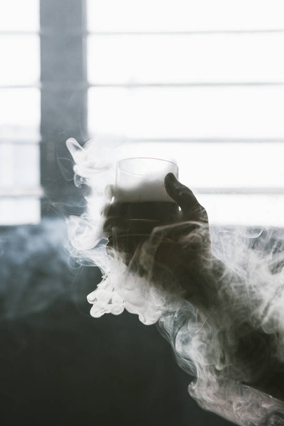 Creative alcoholic cold drink with white smoke - Foto, imagen