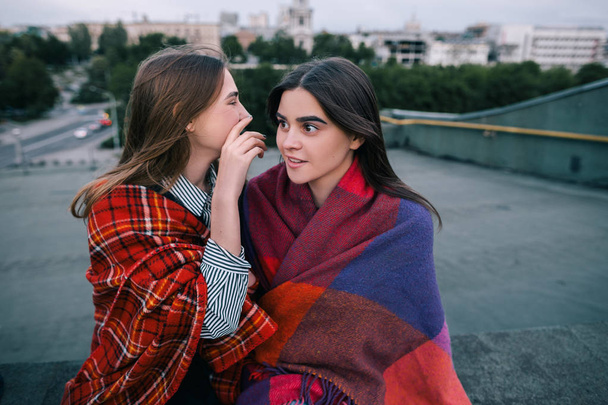 Two young girls gossip of somebody, close up - Φωτογραφία, εικόνα