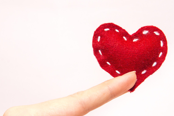 Red heart in fingers - Photo, image