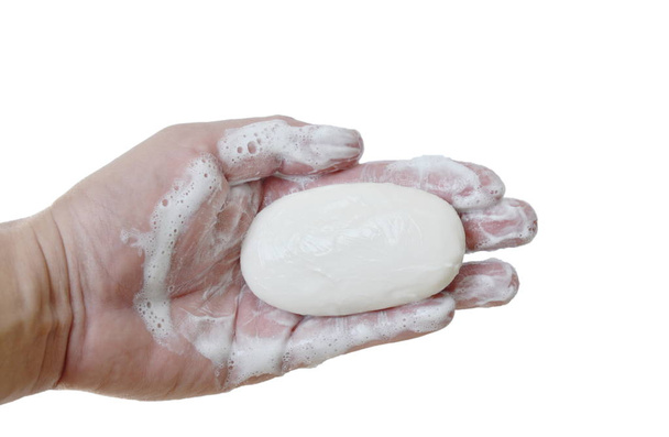 Seife und Blase auf der Hand in weißem Hintergrund - Foto, Bild