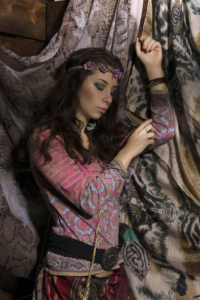 beauty hippie boho woman poses on a wooden background - Zdjęcie, obraz