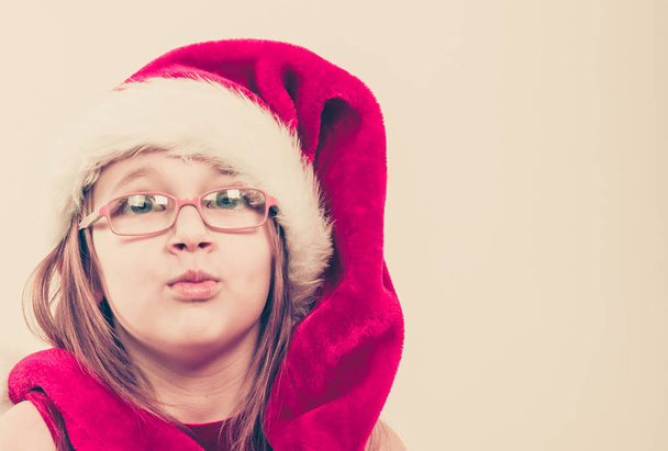 Girl in santa hat making silly face - Photo, Image