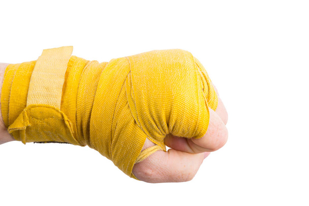 Puño boxeador en vendaje amarillo maltratado, concepto de poder
 - Foto, Imagen
