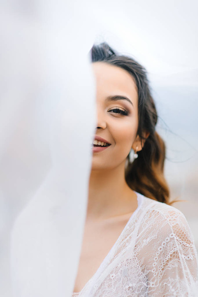 bride in her underwear and a dressing gown - Zdjęcie, obraz
