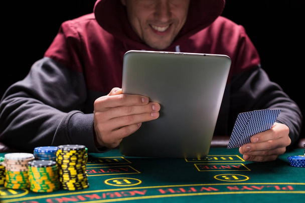 Online poker players sitting at the table - Photo, image