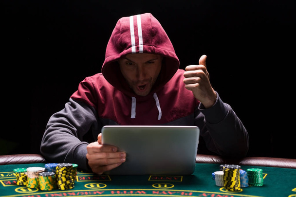 Online poker players sitting at the table - Photo, Image