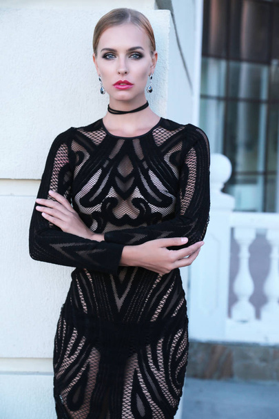 beautiful girl with blond hair in elegant black lace dress - Fotografie, Obrázek