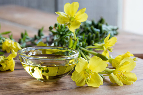 Evening primrose oil in a glass bowl - Photo, Image