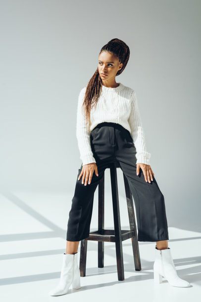 african american model posing with stool - Fotografie, Obrázek
