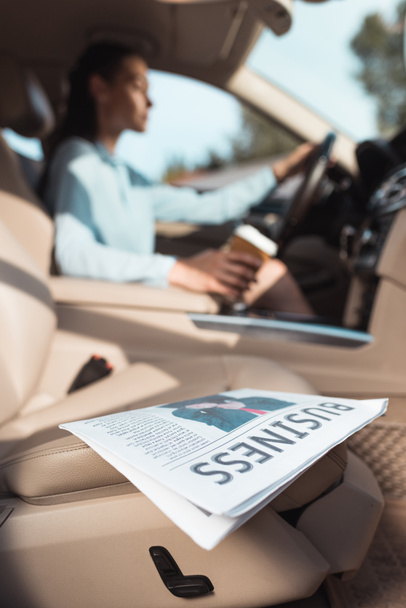 business newspaper in car - Photo, Image