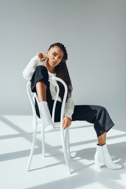 trendy african american girl with chair - Photo, Image