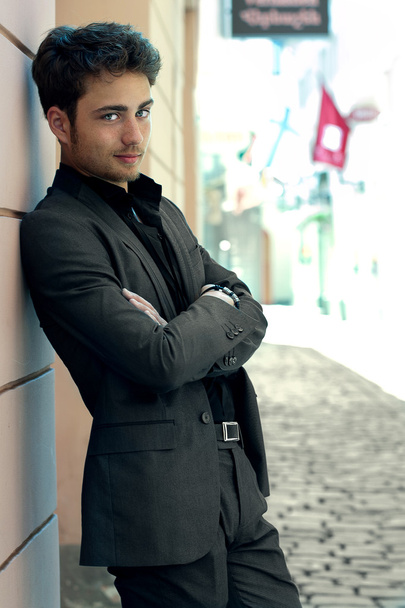 Handsome man standing on a street - Foto, afbeelding