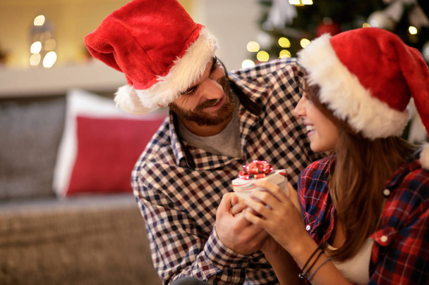 Female and male celebrate Christmas - 写真・画像