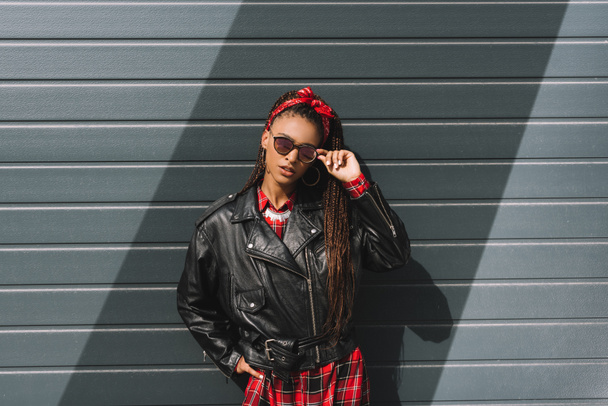 girl in leather jacket and sunglasses - Fotó, kép