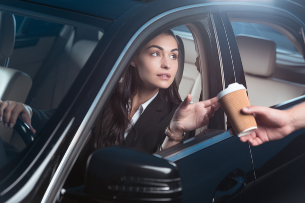 Woman getting coffee in drive-through - Photo, Image
