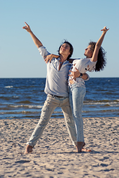 Couple dancing by the sea - Фото, изображение