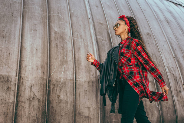 girl in leather jacket and checkered shirt - 写真・画像