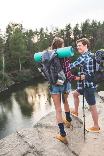 couple with backpacks having hiking trip - Photo, Image