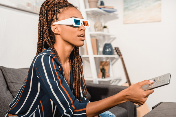 woman watching tv in 3d goggles - Photo, Image