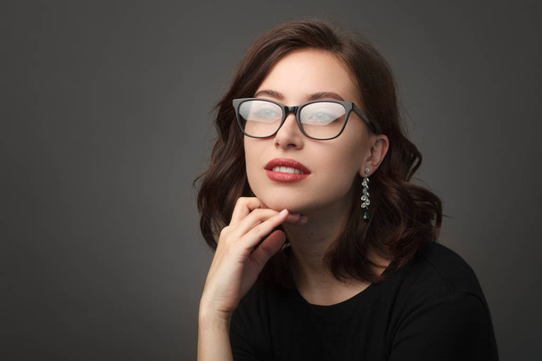Beautiful woman in black rimmed glasses - Фото, зображення