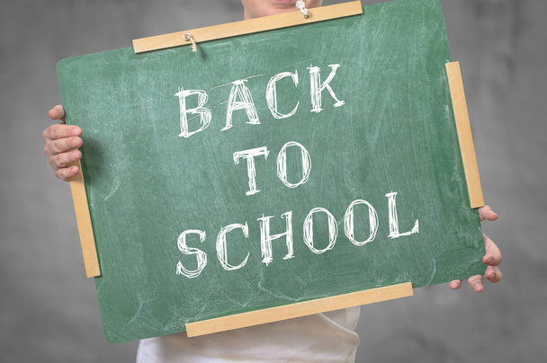 Back to school written on chalkboard - Фото, изображение