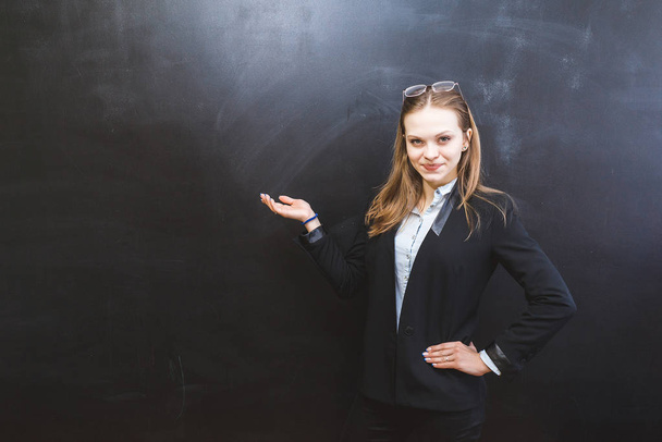 cute smiling girl pointing at the board, office - Фото, изображение