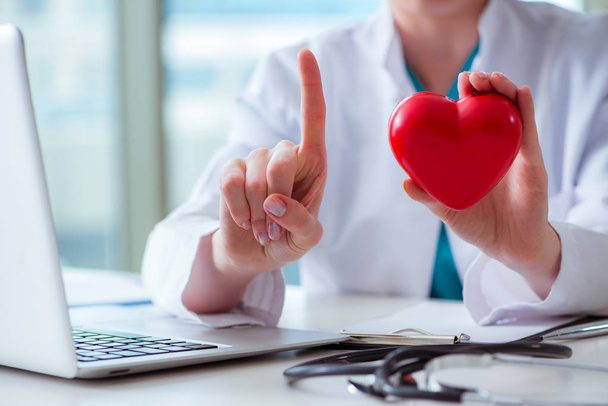 Doctor checking up heart in medical concept - Photo, Image
