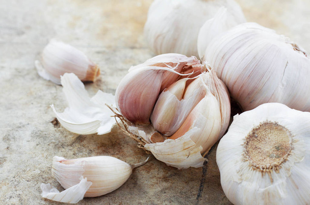 Garlic on old floor. - Photo, Image