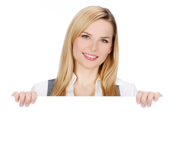 Smiling woman holding blank billboard - Foto, imagen