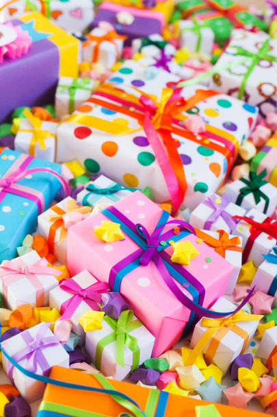Colored gift boxes with colorful ribbons. White background. Gift - 写真・画像