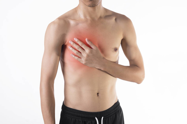 Young man chest pain or heart attack on white background. - Fotó, kép