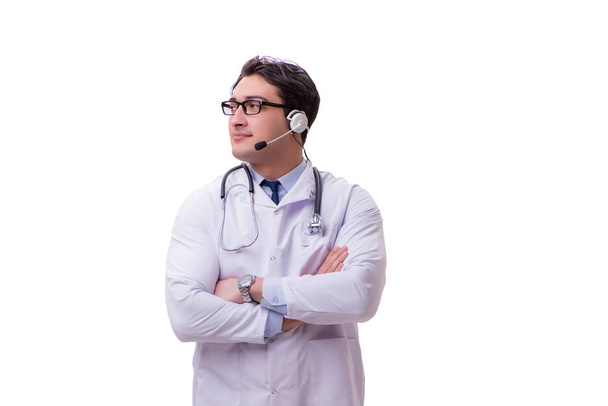 Young doctor with phone headset isolated on white - Foto, Imagen