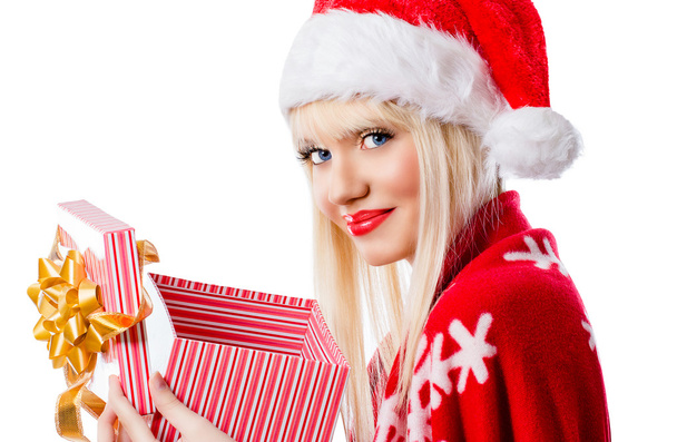 Beautiful blonde woman in red hat with opened gift box - Valokuva, kuva