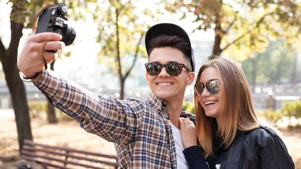 Young man and woman making selfie - Zdjęcie, obraz