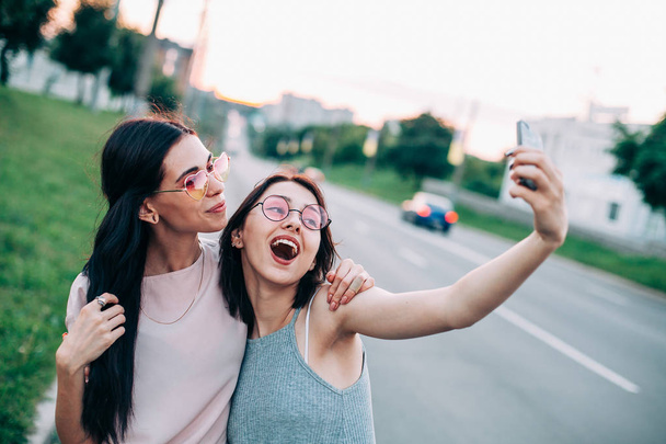 Girls taking selfie - Фото, зображення