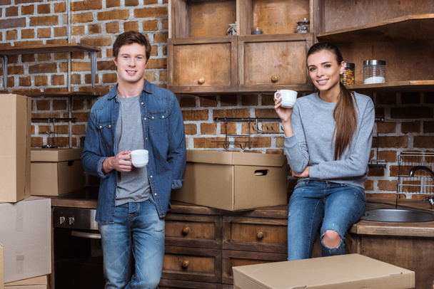 couple with cups of coffee at home - Foto, Bild