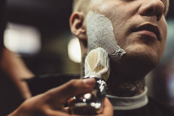 Anonymous barber shaving client - Foto, Imagem