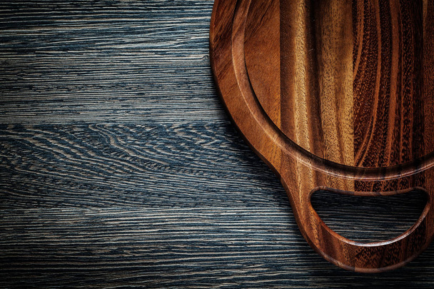 Cutting board on wood background - Foto, afbeelding