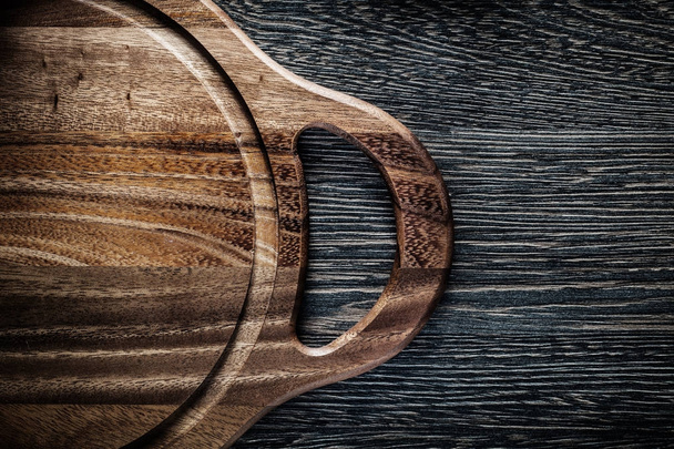Wooden carving board on wood background - Φωτογραφία, εικόνα