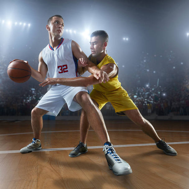 Basketball players on big professional arena - Photo, Image