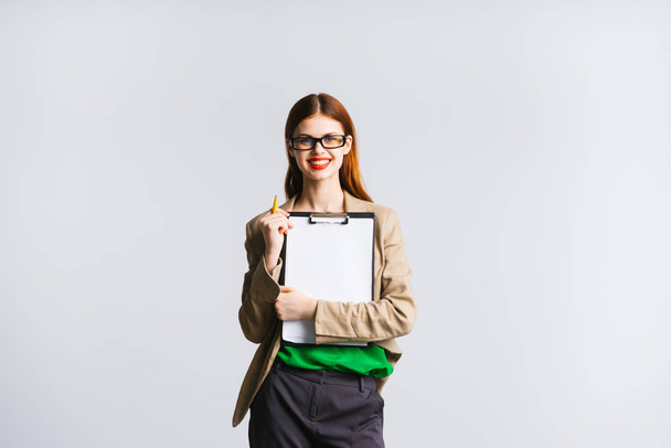 smiling girl with glasses holding a file with a document - Foto, immagini